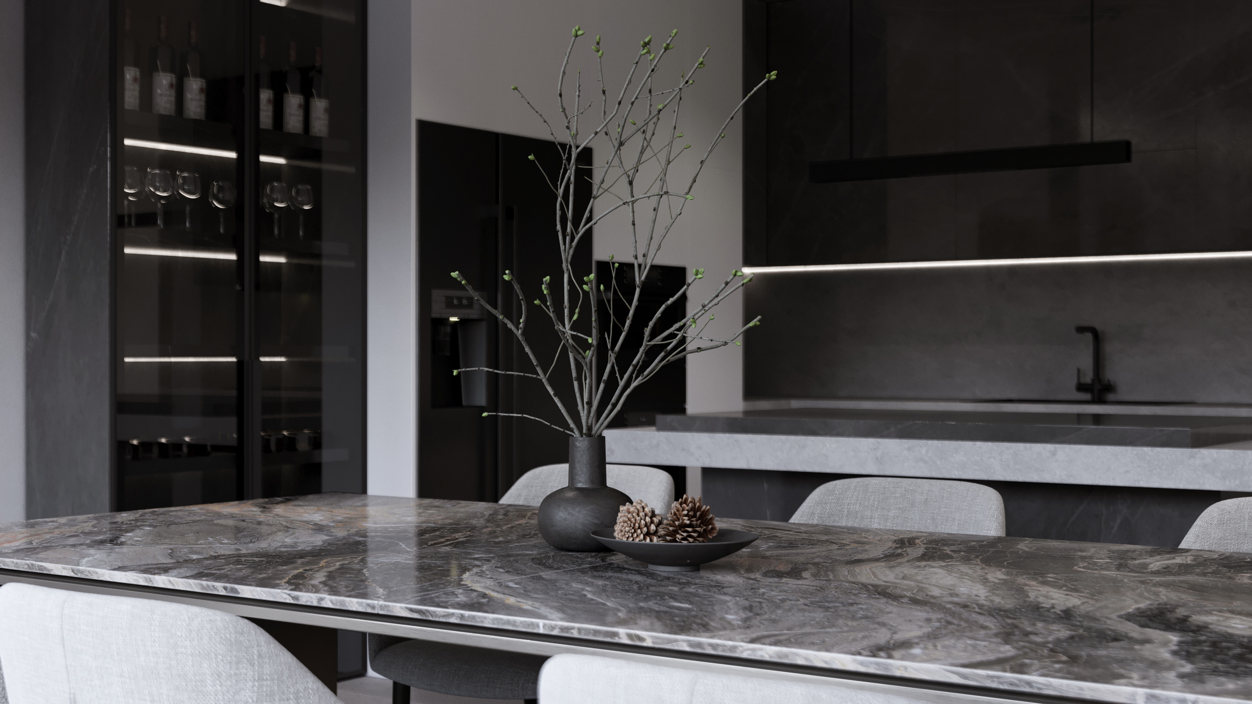 A study in dark stone, restrained joinery and soft daylight across a contemporary residential interior.